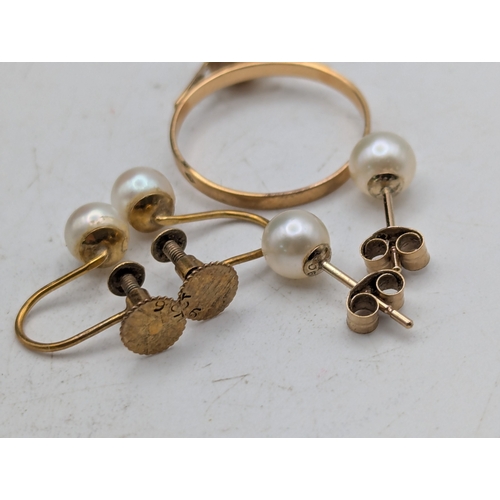 52 - A yellow metal and pearl solitaire ring tested as 18ct yellow gold, size M1/2 weight 1.4g together w... 
