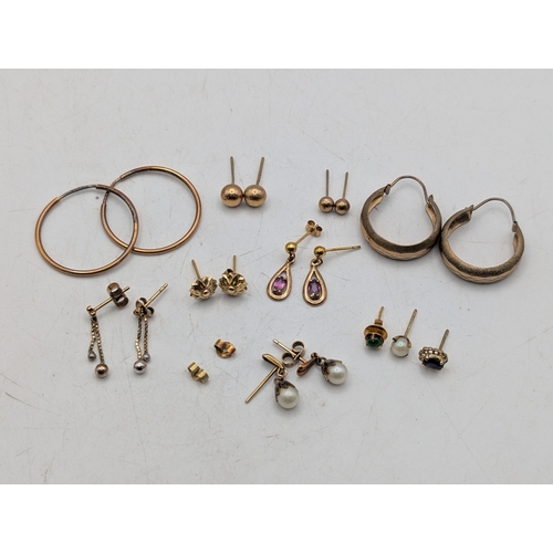 58 - A collection of earrings to include two pairs of 9ct gold earrings 3.5g,  9ct gold stud earrings 2.7... 