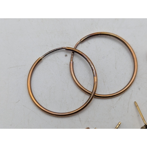 58 - A collection of earrings to include two pairs of 9ct gold earrings 3.5g,  9ct gold stud earrings 2.7... 