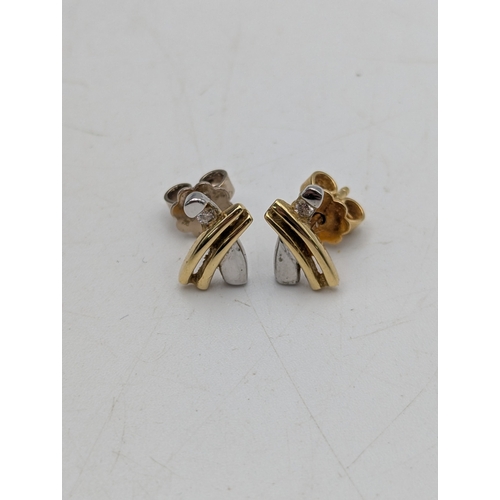 6 - A pair of 18ct gold tri-coloured earrings each set with a small diamond stamped 750, weight 2.7g
Loc... 