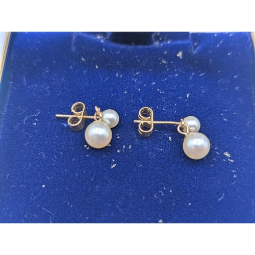 9 - A pair of 9ct yellow gold and pearl drop earrings, together with a 9ct and pearl necklace, total wei... 