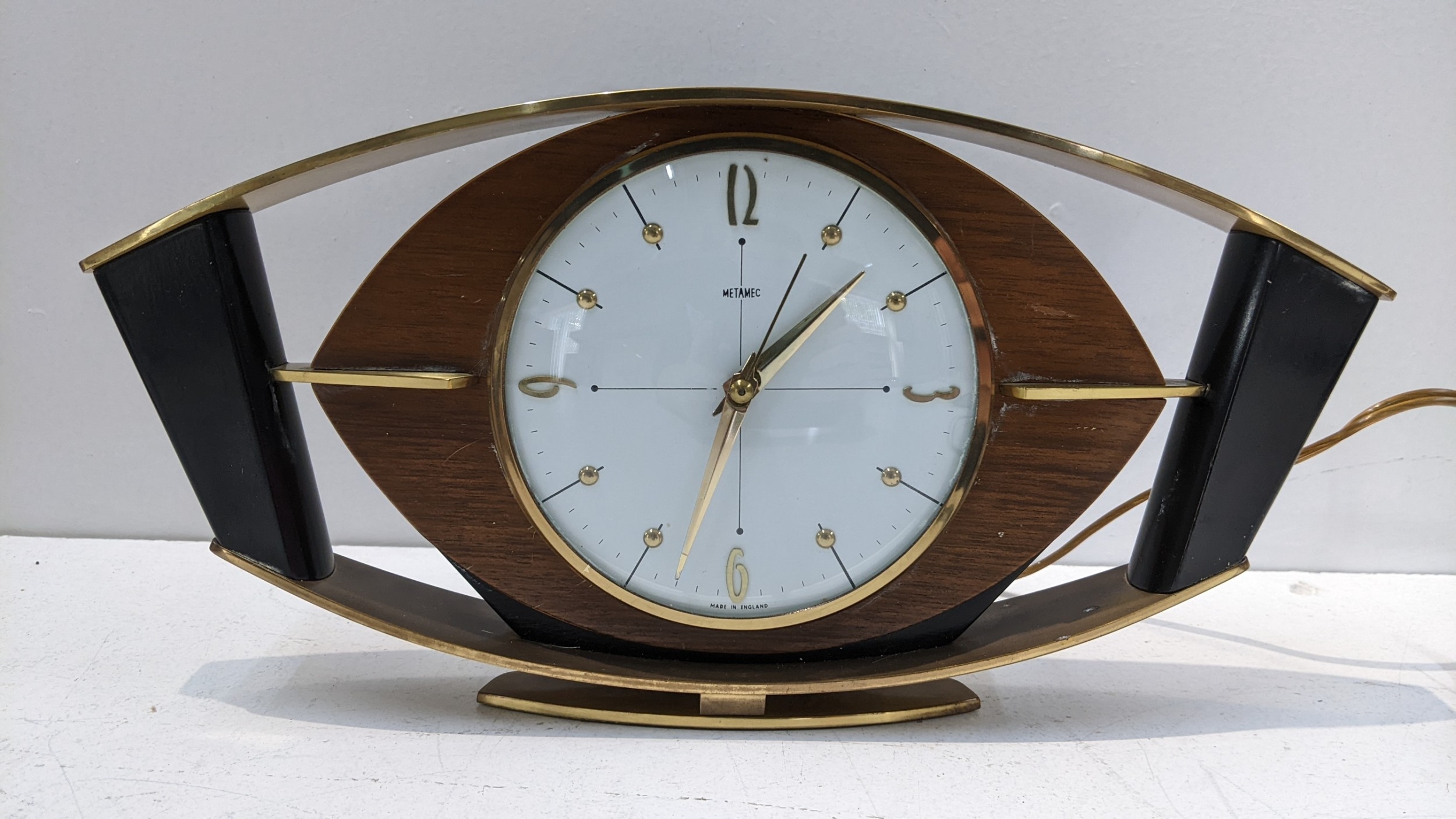 A mid 20th century Metamic electric mantel clock Location:LAF If there ...