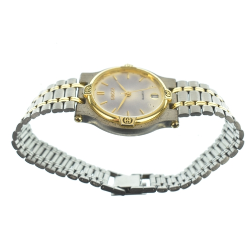 19 - A Gucci 9000L, quartz, ladies bi-metal wristwatch, circa 1990s, the dial with gilt baton hour marker... 