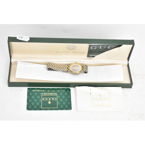19 - A Gucci 9000L, quartz, ladies bi-metal wristwatch, circa 1990s, the dial with gilt baton hour marker... 