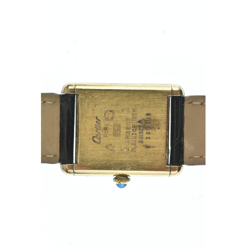 21 - A Cartier Tank Must, manual wind, ladies silver gilt wristwatch, circa 1984, the black dial with whi... 