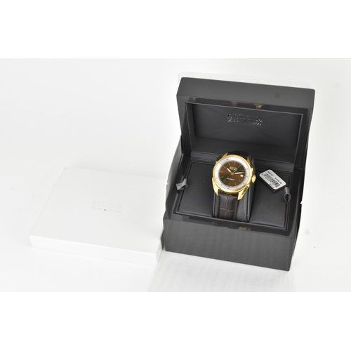40 - A Bulova Accu-Swiss Automatic, gents gold-plated wristwatch, the dial with applied baton hour marker... 