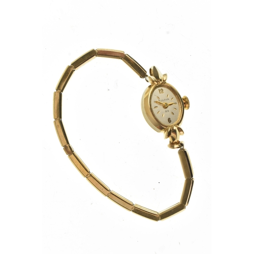 41 - A Bulova, manual wind, ladies, 14ct gold wristwatch, the silvered dial having Arabic numerals and ba... 
