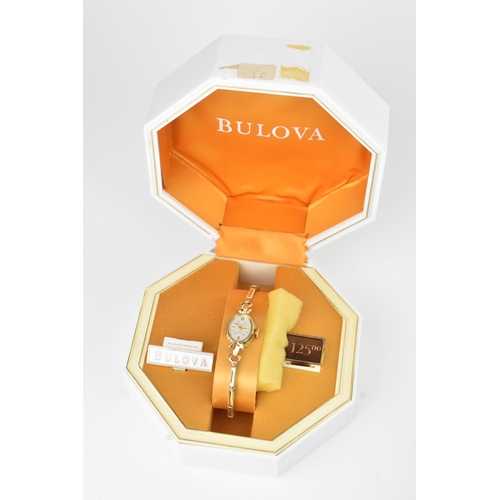 41 - A Bulova, manual wind, ladies, 14ct gold wristwatch, the silvered dial having Arabic numerals and ba... 
