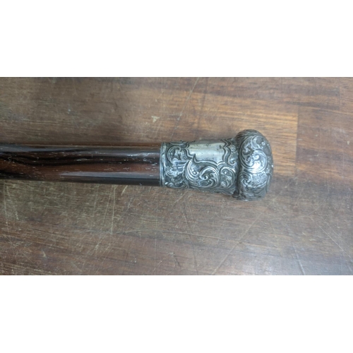 12 - A silver topped vintage walking cane, 85cm long
Location: RAM
If there is no condition report shown,... 
