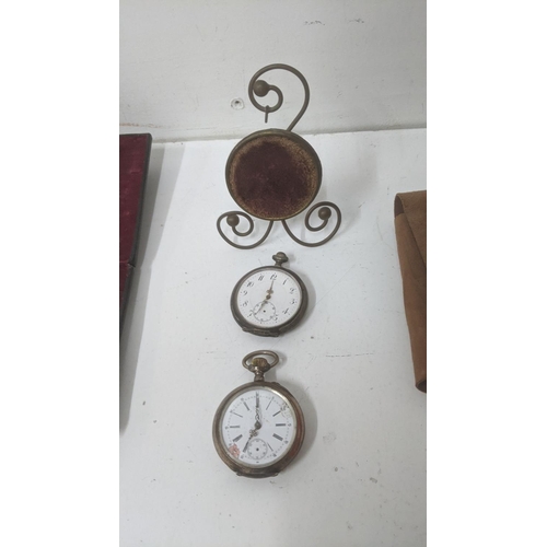 22 - Collectables to include a pair of silver cased early 20th century pocket watches with a stand, along... 