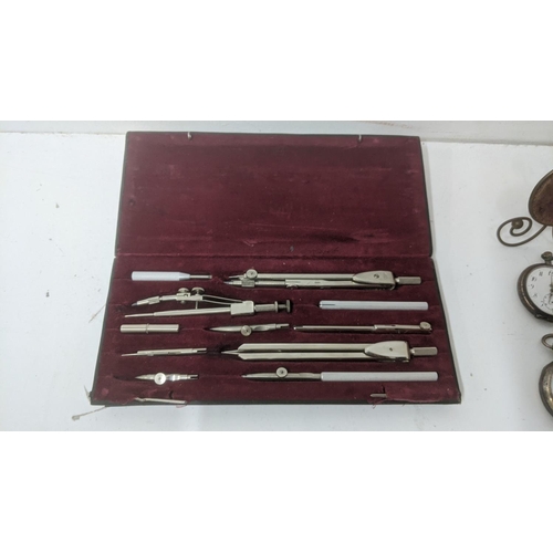 22 - Collectables to include a pair of silver cased early 20th century pocket watches with a stand, along... 