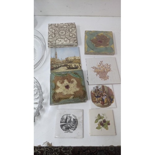 25 - Ceramics and glassware to include a collection of wall tiles, some Victorian, a collection of crysta... 