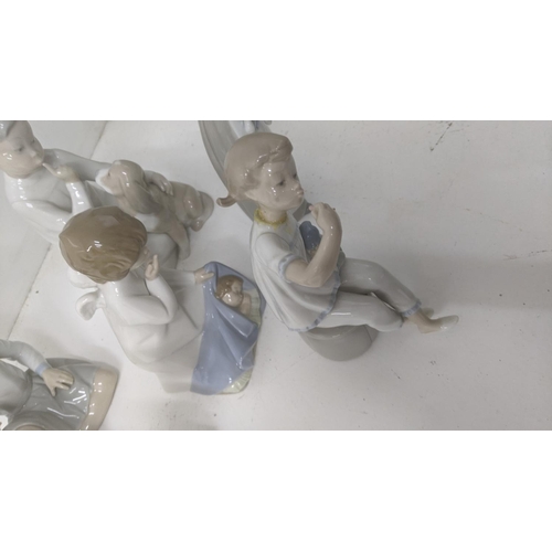 45 - A group of six Lladro Spanish porcelain figures to include 'Boy with Dog', 'Girl with a Flower', and... 