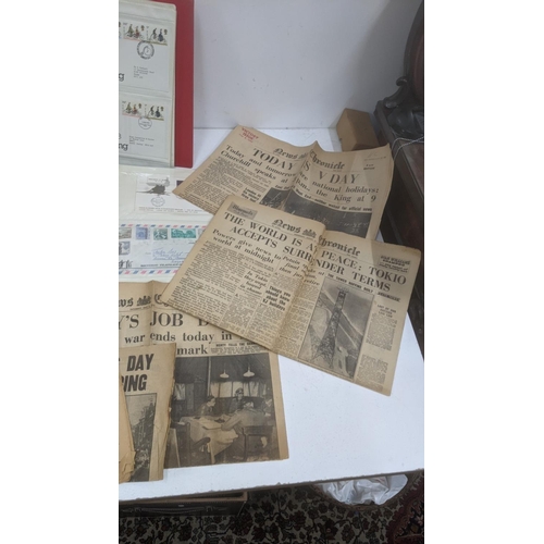 57 - Collection of postcards, First Day covers and stamps and 1945 newspapers
Location: GL
If there is no... 