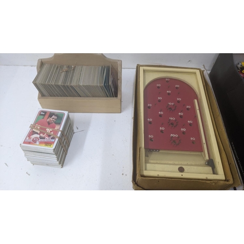 59 - Toys and games to include a vintage Meccano set 3, a collection of Topps 1980's American football co... 