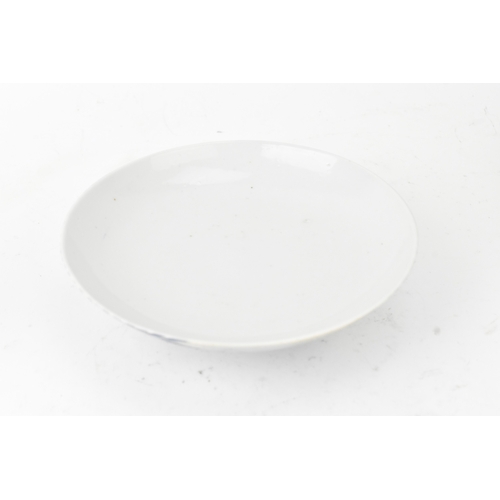 38 - A group of four Chinese and Japanese blue and white porcelain items, comprising: a dragon bowl paint... 