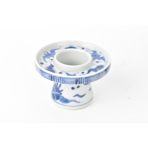 38 - A group of four Chinese and Japanese blue and white porcelain items, comprising: a dragon bowl paint... 