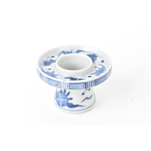 38 - A group of four Chinese and Japanese blue and white porcelain items, comprising: a dragon bowl paint... 