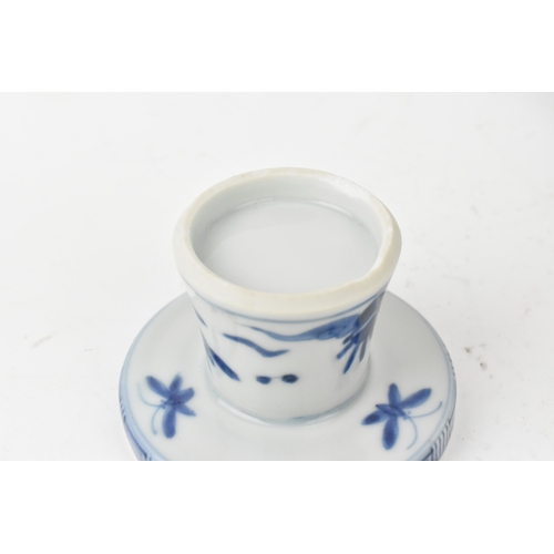 38 - A group of four Chinese and Japanese blue and white porcelain items, comprising: a dragon bowl paint... 