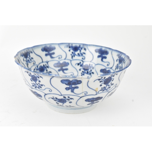 38 - A group of four Chinese and Japanese blue and white porcelain items, comprising: a dragon bowl paint... 