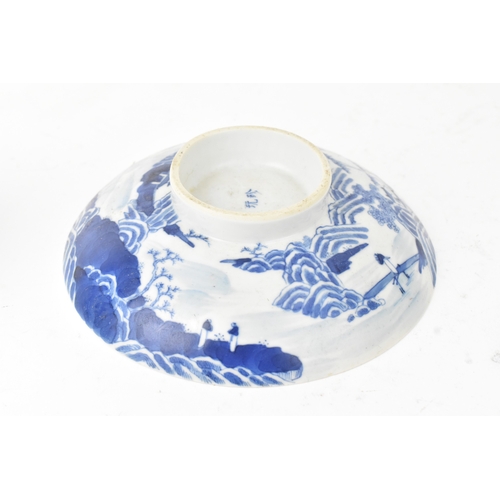 38 - A group of four Chinese and Japanese blue and white porcelain items, comprising: a dragon bowl paint... 