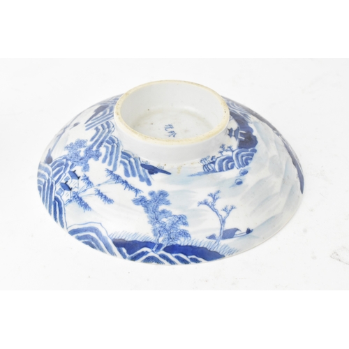 38 - A group of four Chinese and Japanese blue and white porcelain items, comprising: a dragon bowl paint... 
