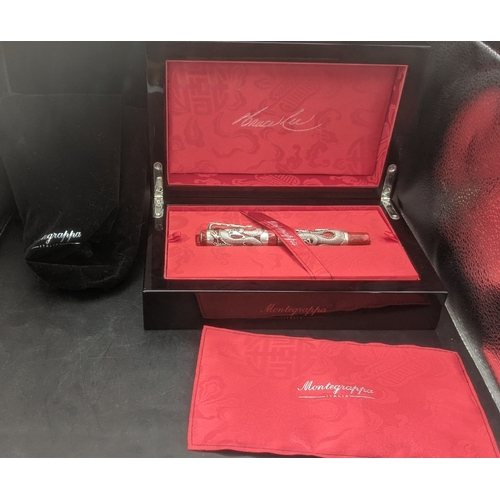 A Montegrappa Icons Bruce Lee limited edition ballpoint pen with red lacquer cap and barrel with silver coloured dragon design with diamond and sapphire set eyes, comes with the box, certificate and related packaging
Location:
If there is no condition report shown, please request