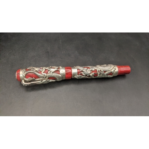 1 - A Montegrappa Icons Bruce Lee limited edition ballpoint pen with red lacquer cap and barrel with sil... 