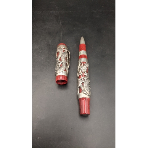 1 - A Montegrappa Icons Bruce Lee limited edition ballpoint pen with red lacquer cap and barrel with sil... 