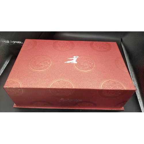 1 - A Montegrappa Icons Bruce Lee limited edition ballpoint pen with red lacquer cap and barrel with sil... 