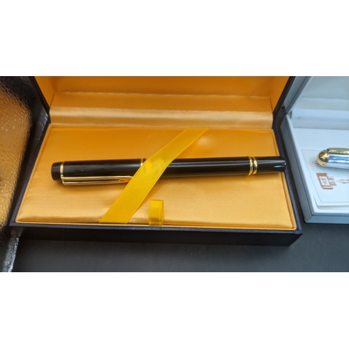 11 - Boxed pens to include a black cased Waterman ideal fountain pen with an 18ct gold nib along with a s... 