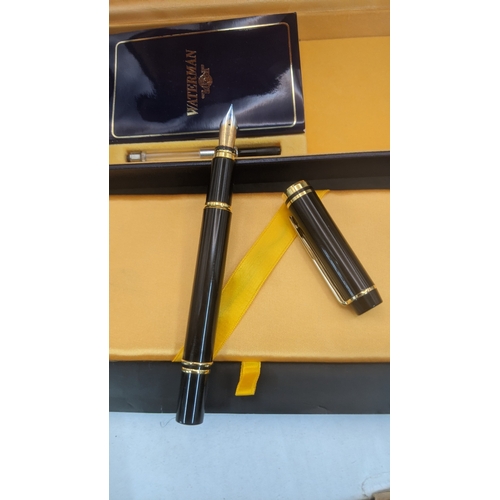 11 - Boxed pens to include a black cased Waterman ideal fountain pen with an 18ct gold nib along with a s... 