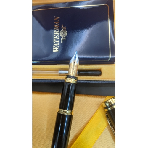 11 - Boxed pens to include a black cased Waterman ideal fountain pen with an 18ct gold nib along with a s... 