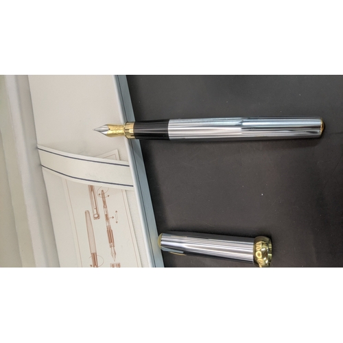 11 - Boxed pens to include a black cased Waterman ideal fountain pen with an 18ct gold nib along with a s... 