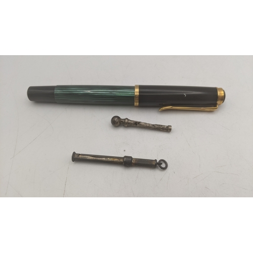 15 - Writing equipment to include a vintage Pelikan fountain pen, along with two vintage propelling penci... 