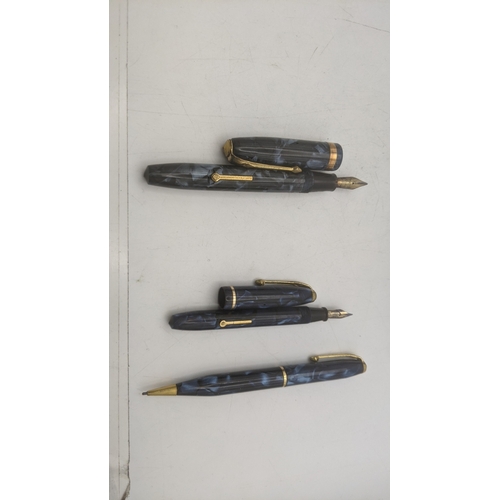 19 - Conway Stewart vintage writing equipment to include a boxed no 84 lever fill fountain pen with a 14c... 