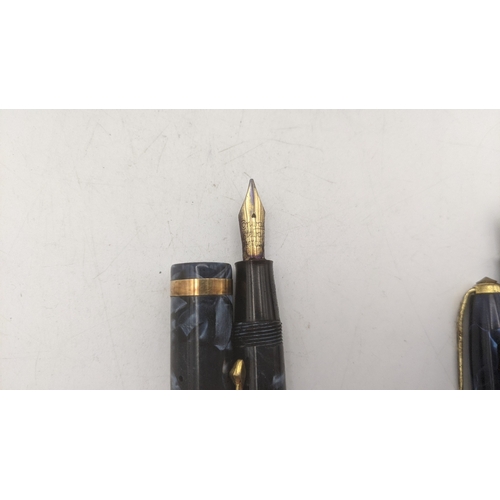 19 - Conway Stewart vintage writing equipment to include a boxed no 84 lever fill fountain pen with a 14c... 