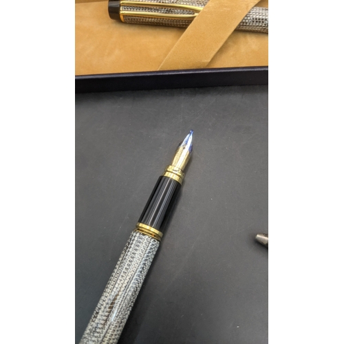2 - A boxed waterman Rhapsody ballpoint pen with snakeskin lacquered design along with a boxed Waterman ... 