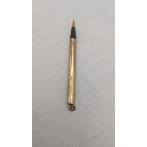 22 - A vintage Watermans 14kt gold cased propelling pencil with an engine turned design Location:C1
If th... 