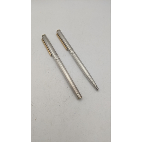 23 - A Montblanc Noblesse fountain pen and ballpoint pen set with stainless steel cases, the ballpoint pe... 