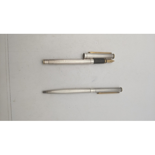 23 - A Montblanc Noblesse fountain pen and ballpoint pen set with stainless steel cases, the ballpoint pe... 