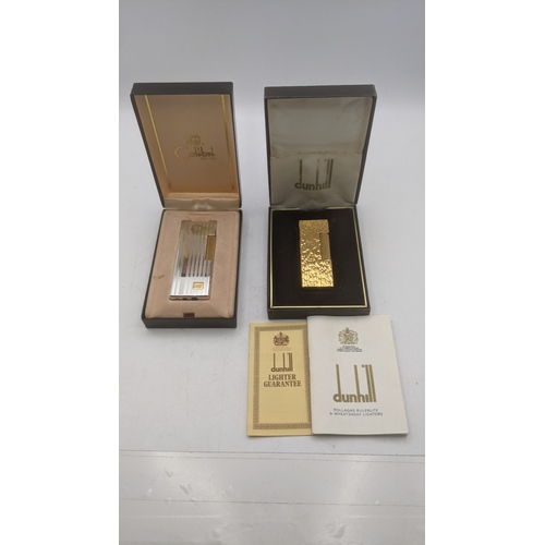 25 - Boxed cigarette lighters to include a gold plated Dunhill Rollagas lighter along with a silver plate... 