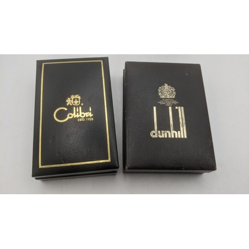 25 - Boxed cigarette lighters to include a gold plated Dunhill Rollagas lighter along with a silver plate... 