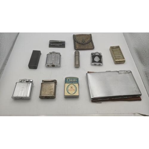 26 - Smoking related items to include two Ronson Whirlwind lighters, a silver plated all in one lighter/c... 
