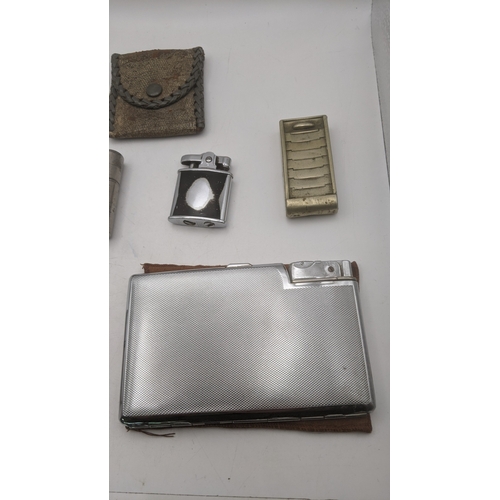 26 - Smoking related items to include two Ronson Whirlwind lighters, a silver plated all in one lighter/c... 