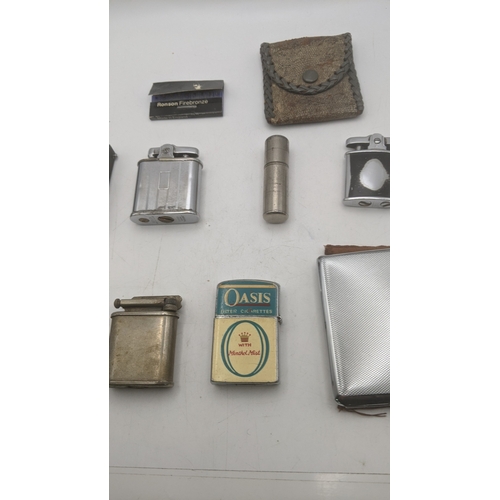 26 - Smoking related items to include two Ronson Whirlwind lighters, a silver plated all in one lighter/c... 