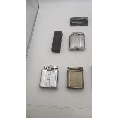 26 - Smoking related items to include two Ronson Whirlwind lighters, a silver plated all in one lighter/c... 