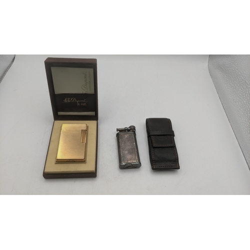 27 - Two cigarette lighters to include a silver plated vintage Dunhill Unique in a branded leather case a... 