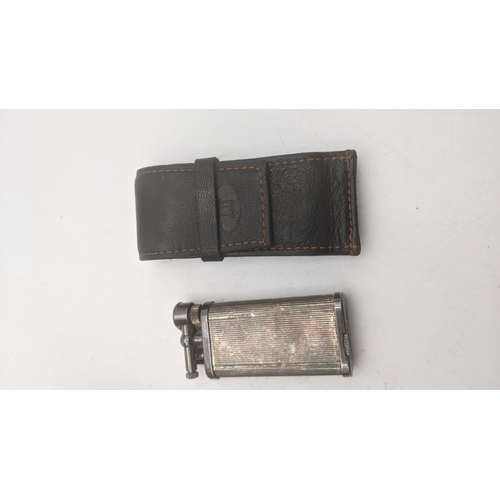 27 - Two cigarette lighters to include a silver plated vintage Dunhill Unique in a branded leather case a... 