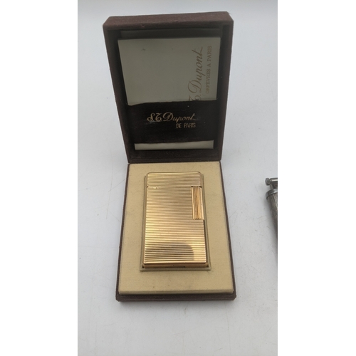 27 - Two cigarette lighters to include a silver plated vintage Dunhill Unique in a branded leather case a... 
